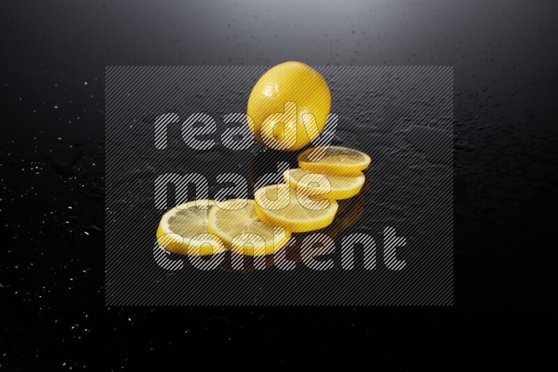 Lemon slices with water drops, and droplets on black background