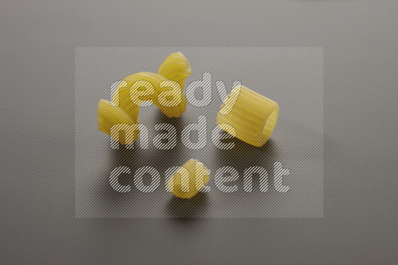 Different pasta types on grey background