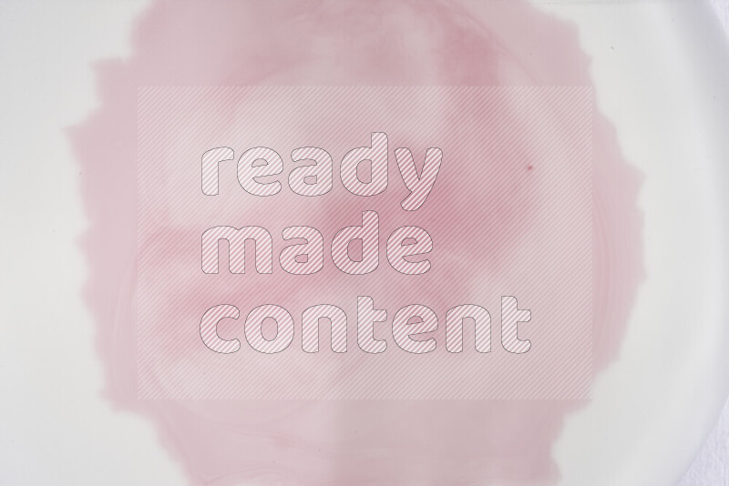 A close-up of abstract swirling patterns in red and white