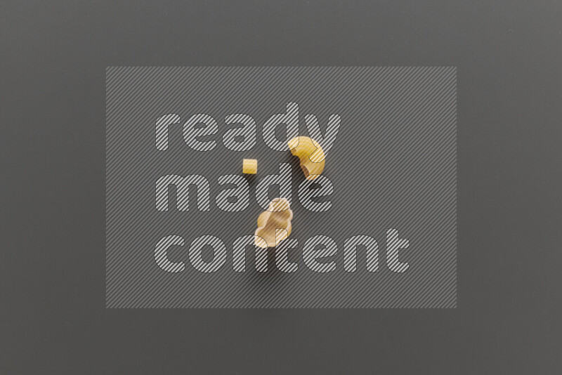 Different pasta types on grey background
