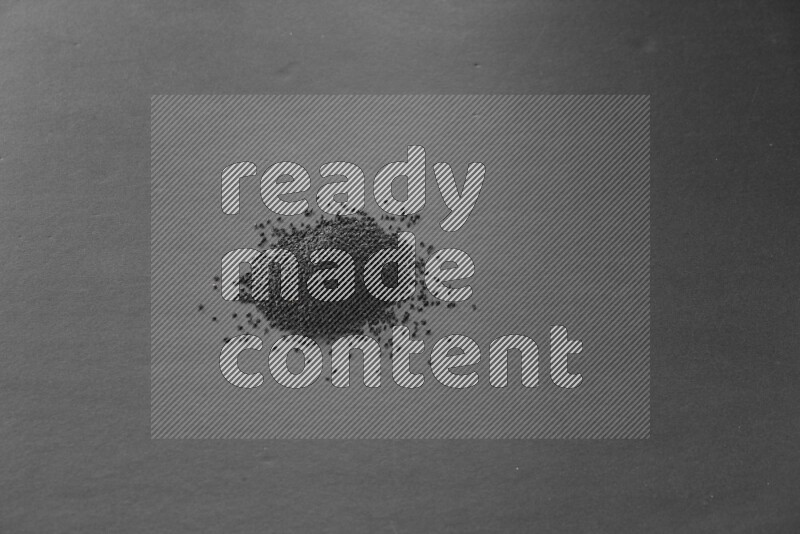 Black seeds on a black flooring