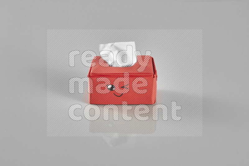 Origami tissue box on grey background