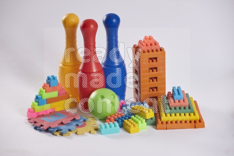 Collection of colorful different kids toys on white background
