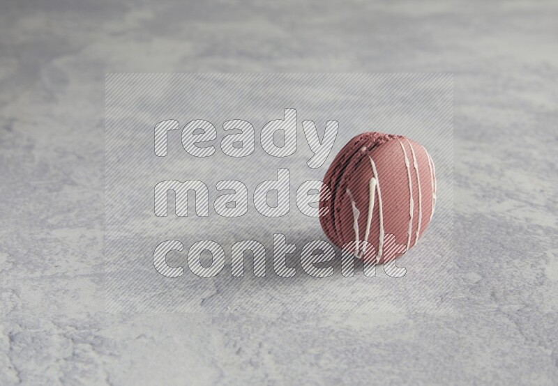 45º Shot of Red Poppy Flower macaron on white  marble background