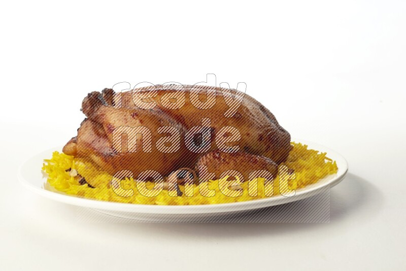 yellow  basmati Rice with  whole roasted chicken on a white rounded plate direct on white background