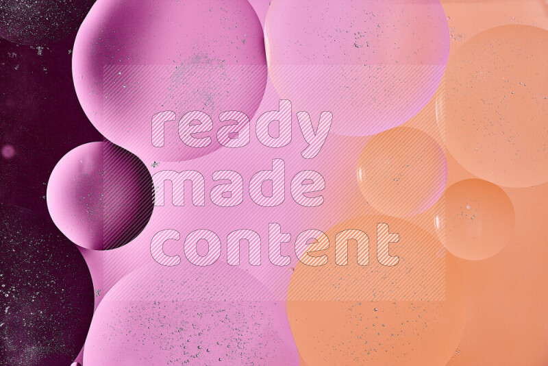 Close-ups of abstract oil bubbles on water surface in shades of purple, orange and pink