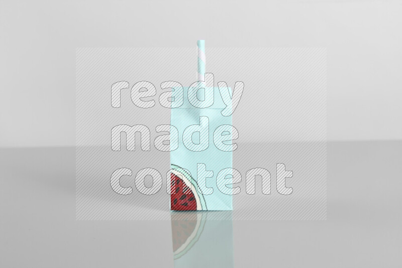 Origami juice box on grey background
