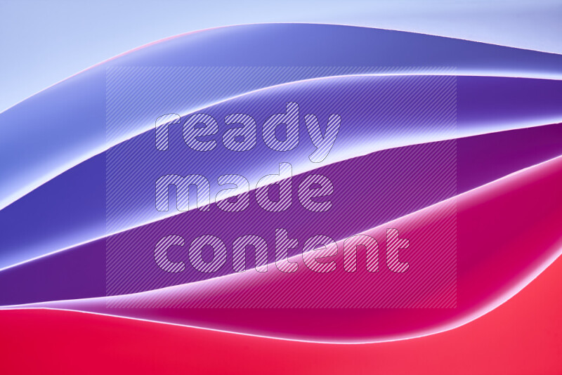 هذه الصورة تعرض تكوين فن الورق التجريدي مع منحنيات ورقية بتدرجات باردة ودافئة مختلفة مكونه بواسطة الضوء الملون