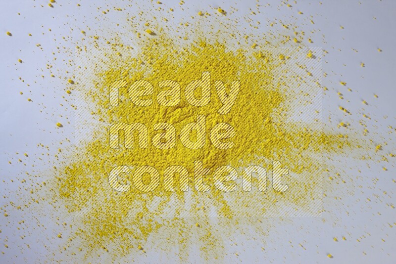 Yellow powder on white background