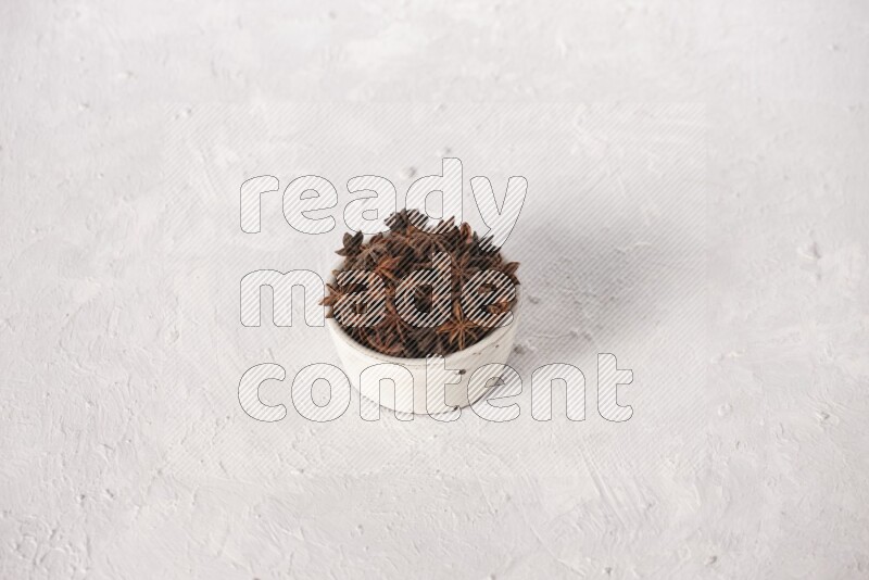 Star Anise in a white bowl on white background