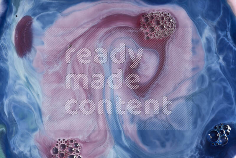 A close-up of abstract swirling patterns in blue, red and white