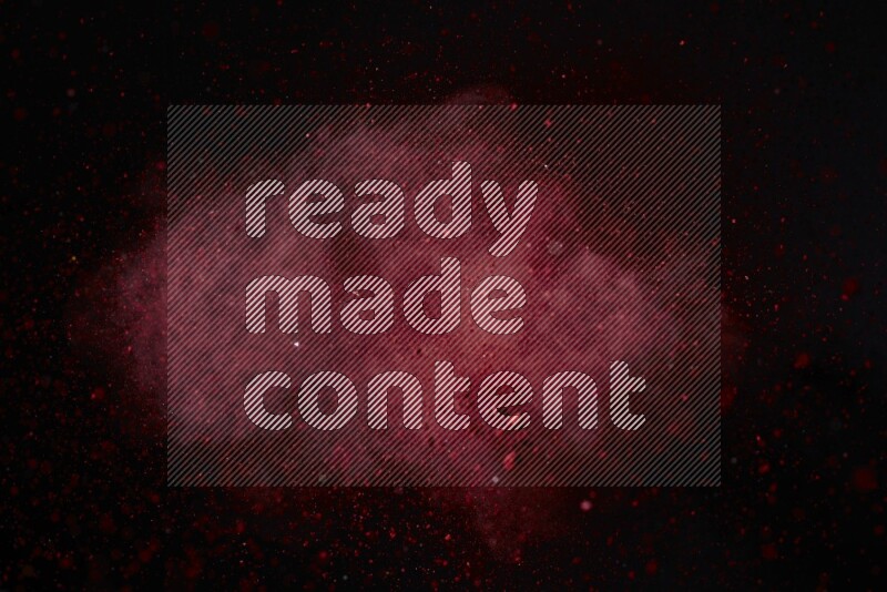Red powder explosion on black background