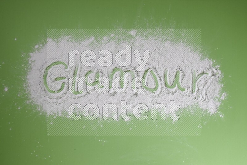 A word written with powder on green background