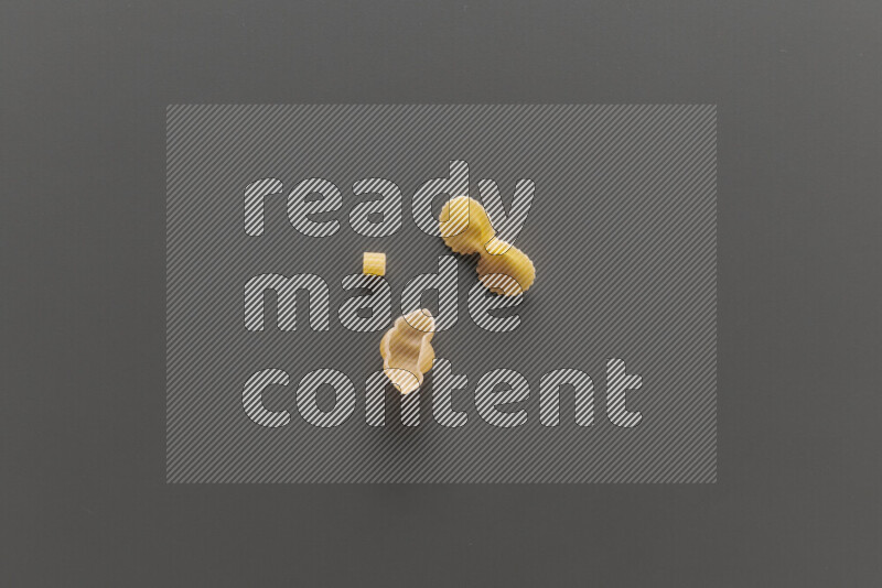Different pasta types on grey background