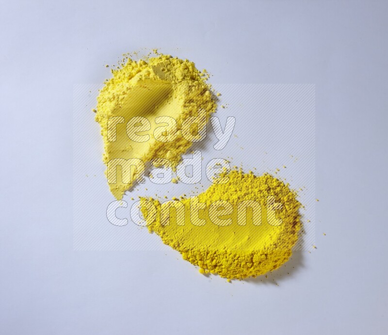 Yellow powder strokes on white background