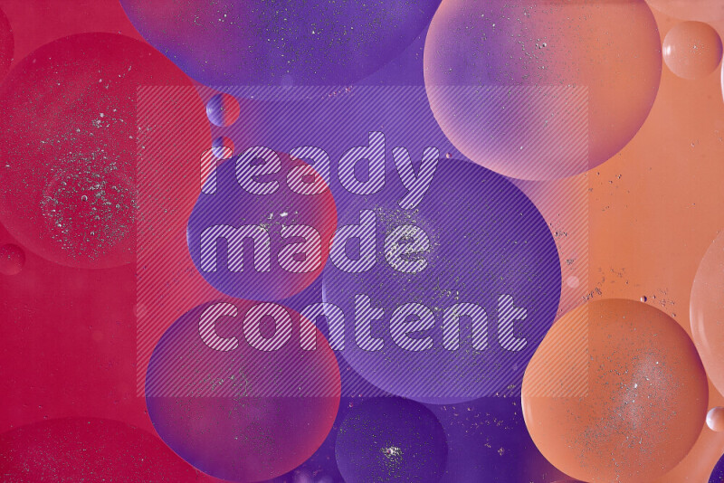 Close-ups of abstract oil bubbles on water surface in shades of red, orange and purple