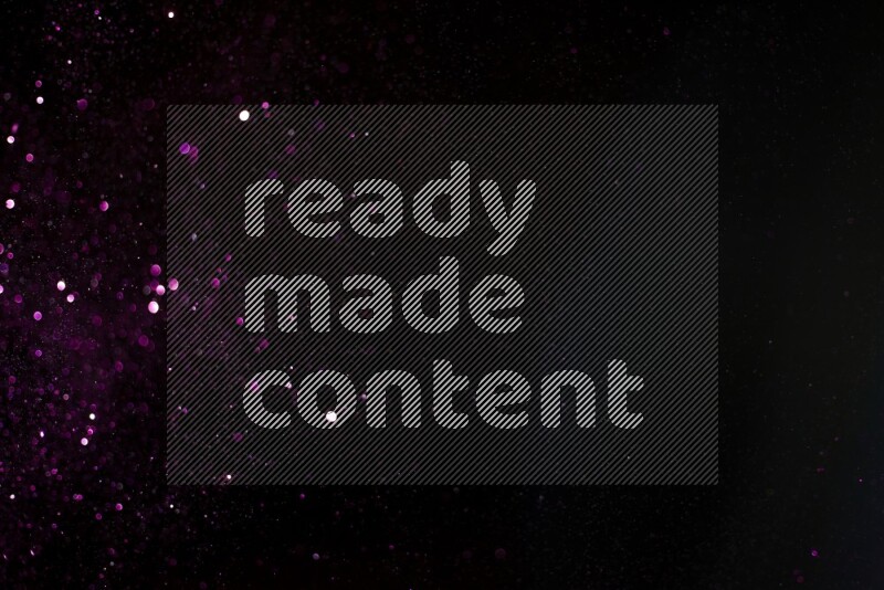 Pink glitter powder isolated on black background