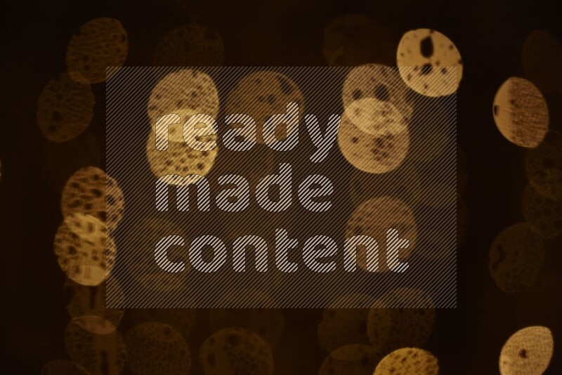 Bokeh light in yellow with water drops