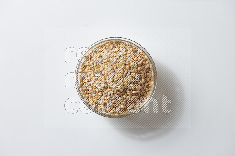 Hulled wheat on white background