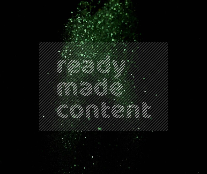 Green glitter powder isolated on black background