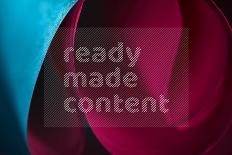 فن تجريدي يعرض منحنيات وتدرجات اللون الأزرق والأحمر مكونه بضوء ملون