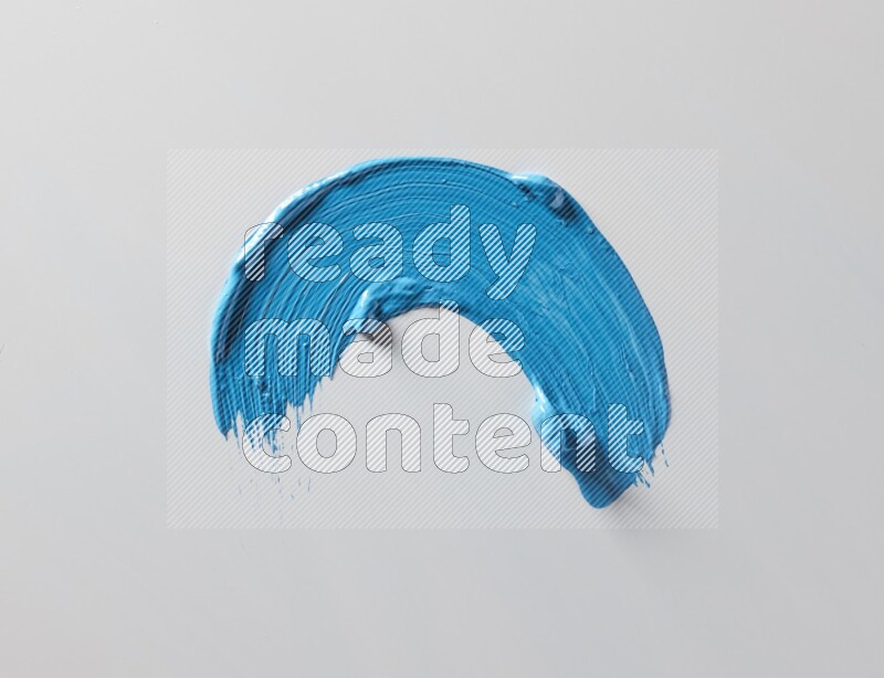 A single blue curved brush stroke on a white background