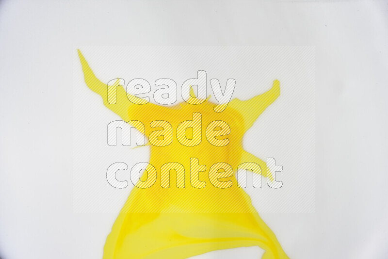 A close-up of abstract swirling patterns in yellow and white