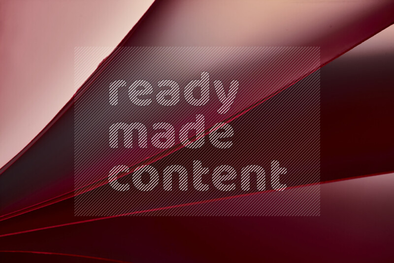 فن تجريدي يعرض منحنيات مع تدرجات الألوان الدافئة والباردة مكونه بضوء ملون