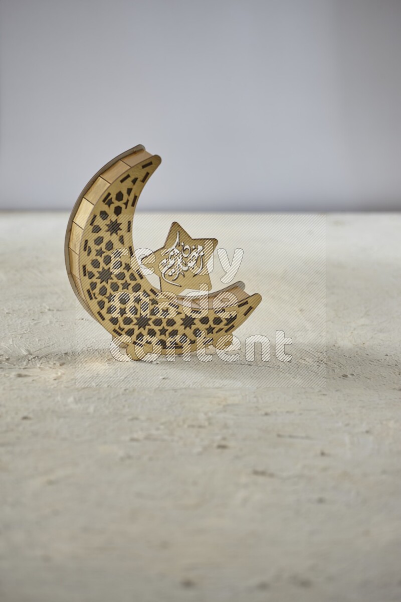 A lantern placed on a textured white background