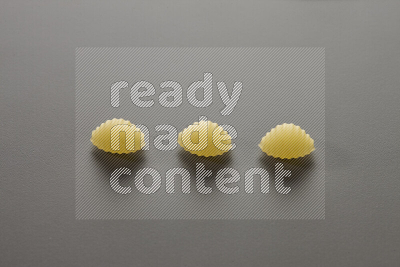 Shells pasta on grey background