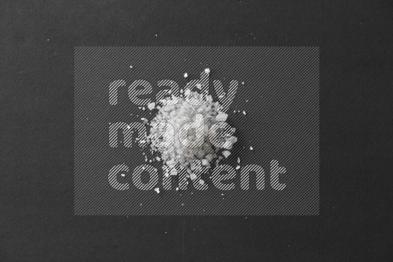 Salt on a black flooring