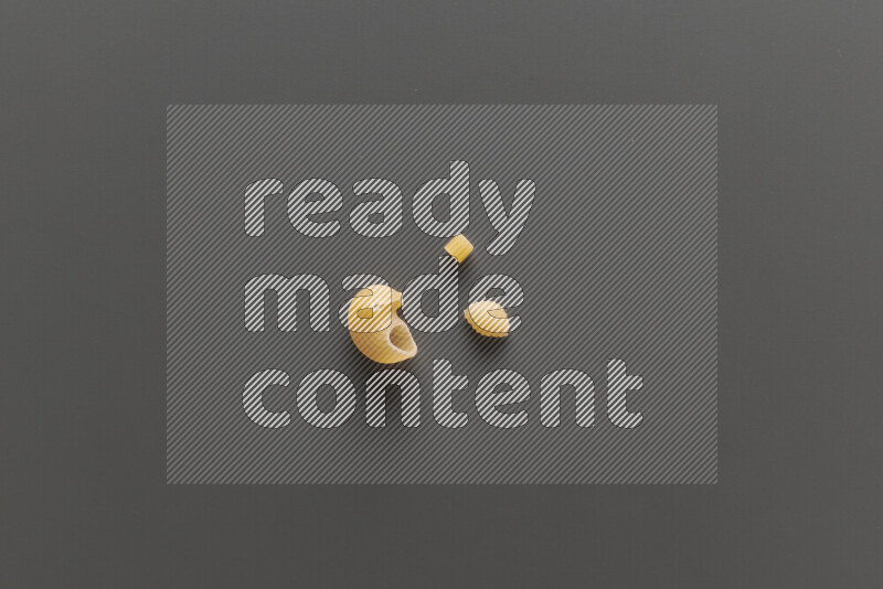 Different pasta types on grey background