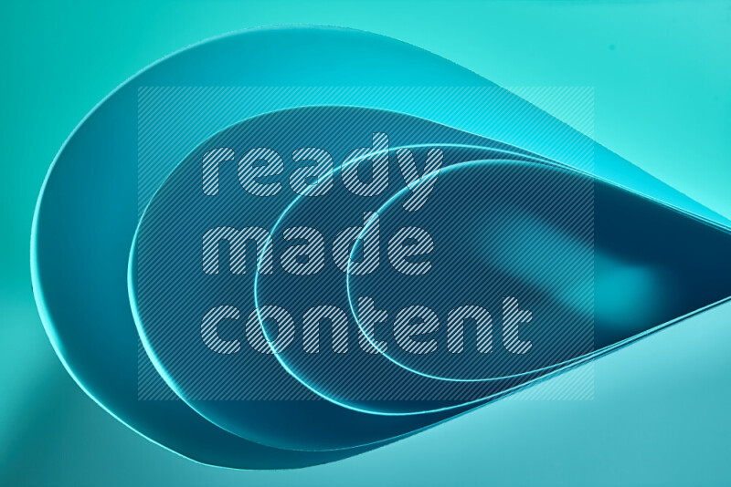 An abstract art of paper folded into smooth curves in blue gradients