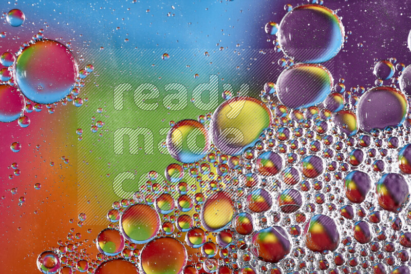 Close-ups of abstract soap bubbles and water droplets on multicolored background
