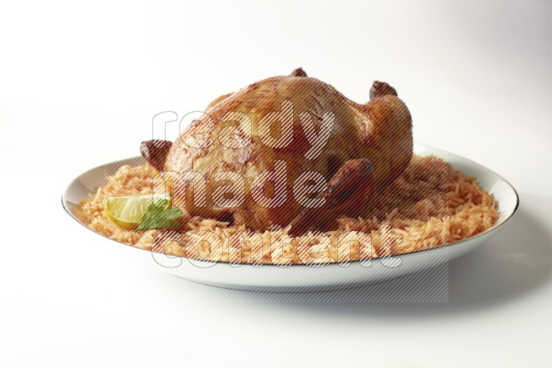 red basmati Rice with whole roasted chicken on a white plate with a silver rim direct on white background