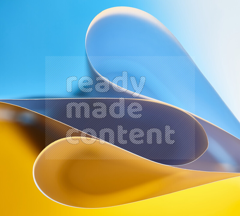 An abstract art of paper folded into smooth curves in blue and yellow gradients