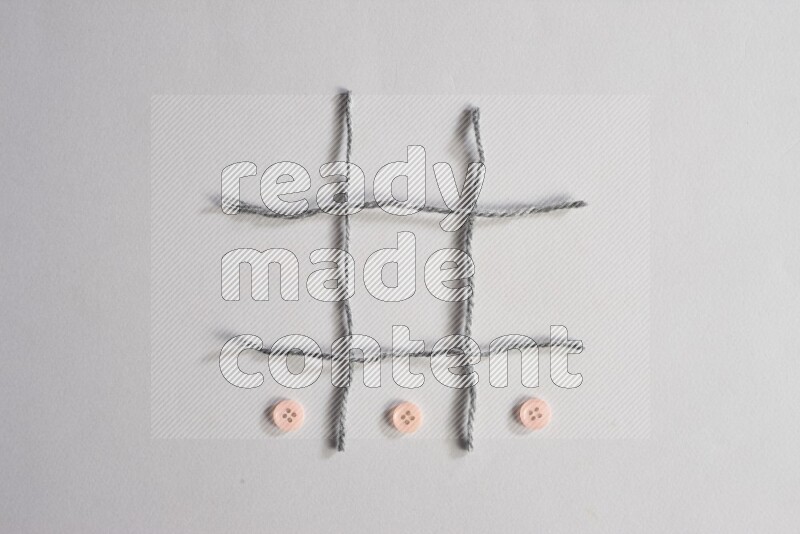 أزرار زهرية موضوعة علي خلفية رمادية