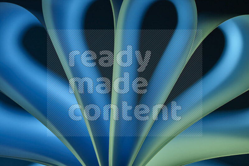 فن تجريدي يعرض منحنيات وتدرجات اللون الأزرق والأخضر مكونه بضوء ملون