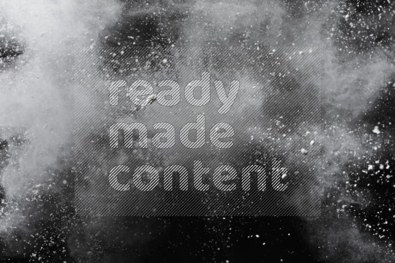 White powder explosion on black background