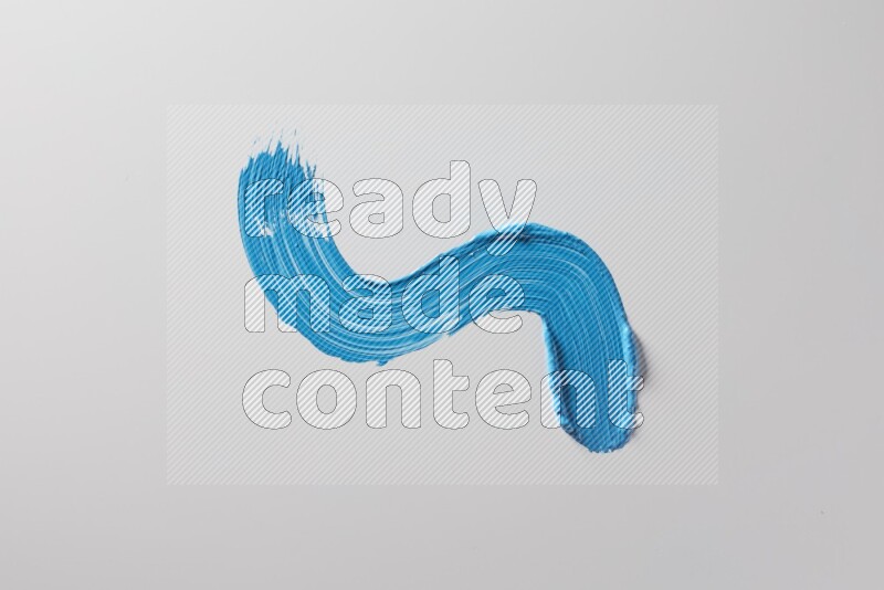 A single blue S curved brush stroke on a white background
