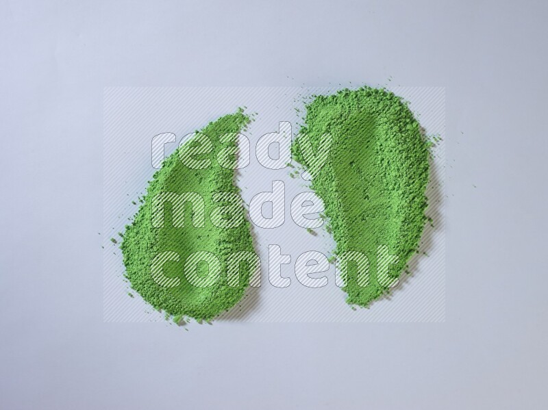Green powder strokes on white background
