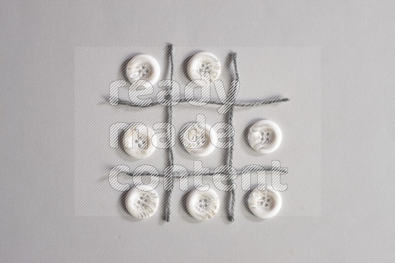 White buttons placed on grey background