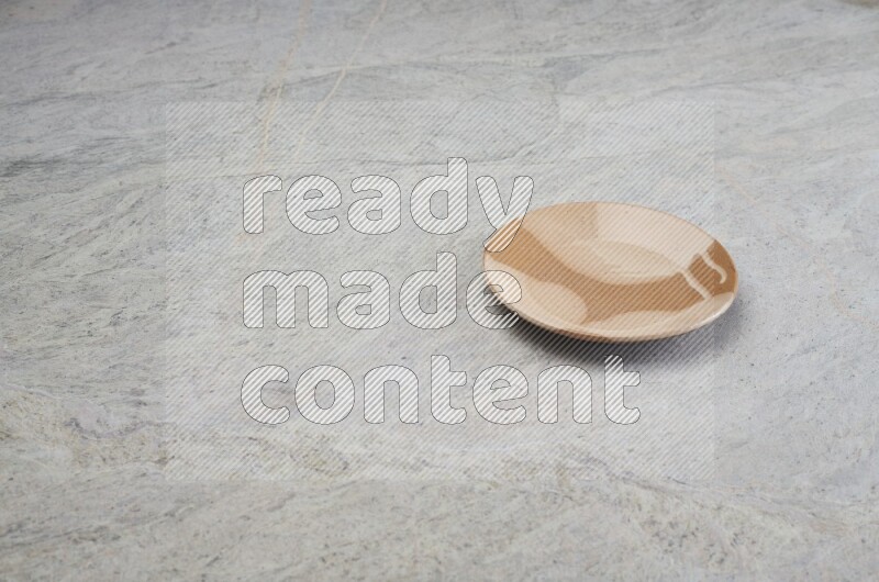 Multicolored Pottery Plate On Grey Marble Flooring