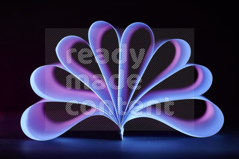 An abstract art piece displaying smooth curves in blue and purple gradients created by colored light