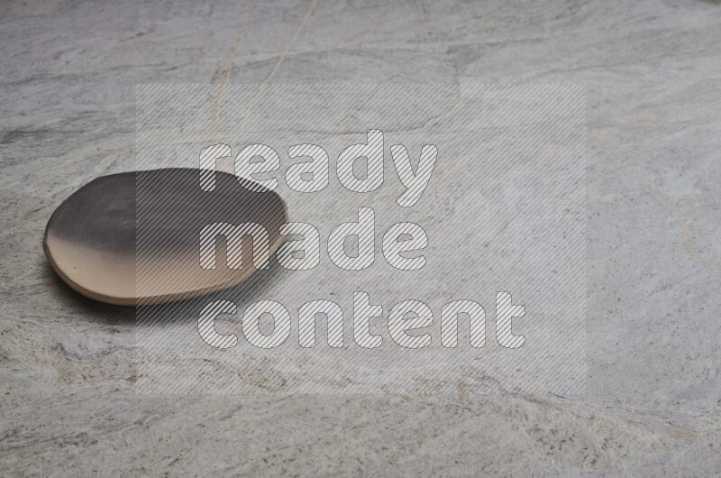 Multicolored Pottery Plate On Grey Marble Flooring