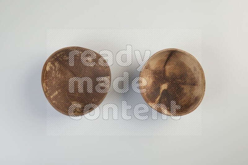 Wooden bowl and plate on white background