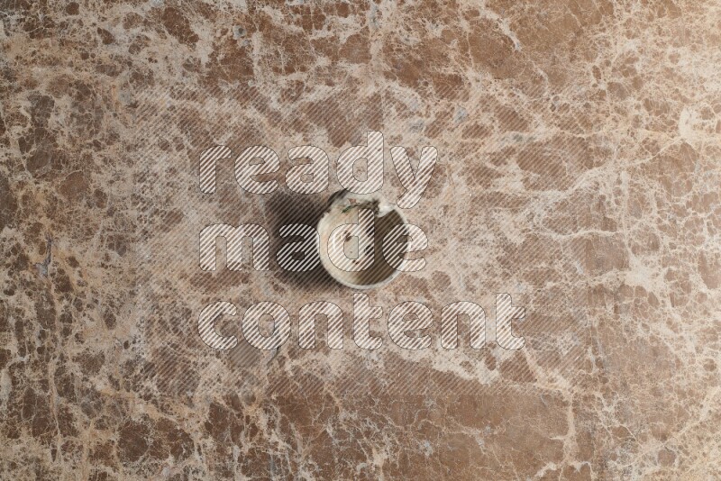 A pottery soap holder on beige marble background