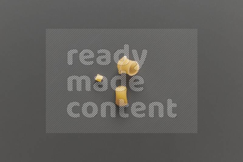 Different pasta types on grey background