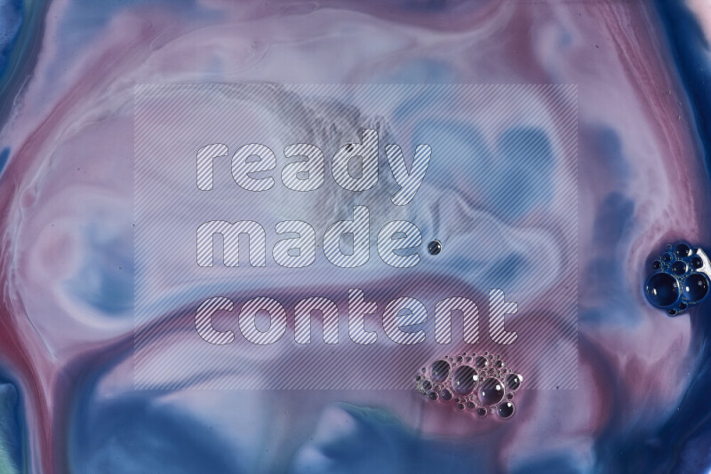 A close-up of abstract swirling patterns in blue, red and white