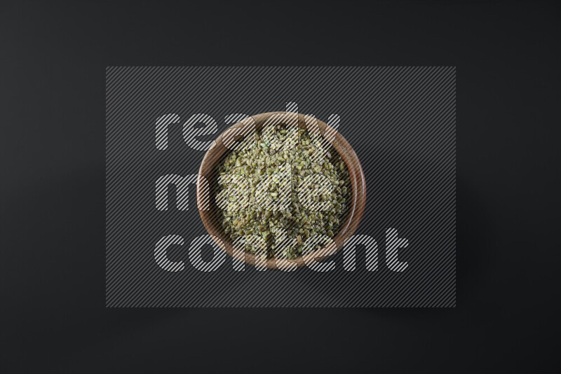 Freekeh in a wooden bowl on grey background